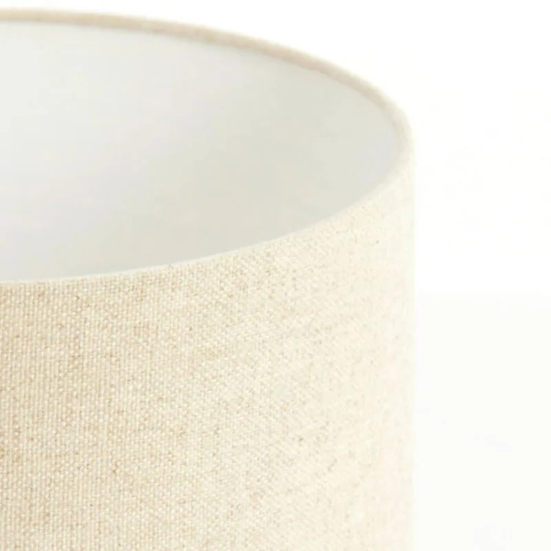 Close-up of the coarse oatmeal linen weave and white lined rim of the LIVIGNO cylinder shade