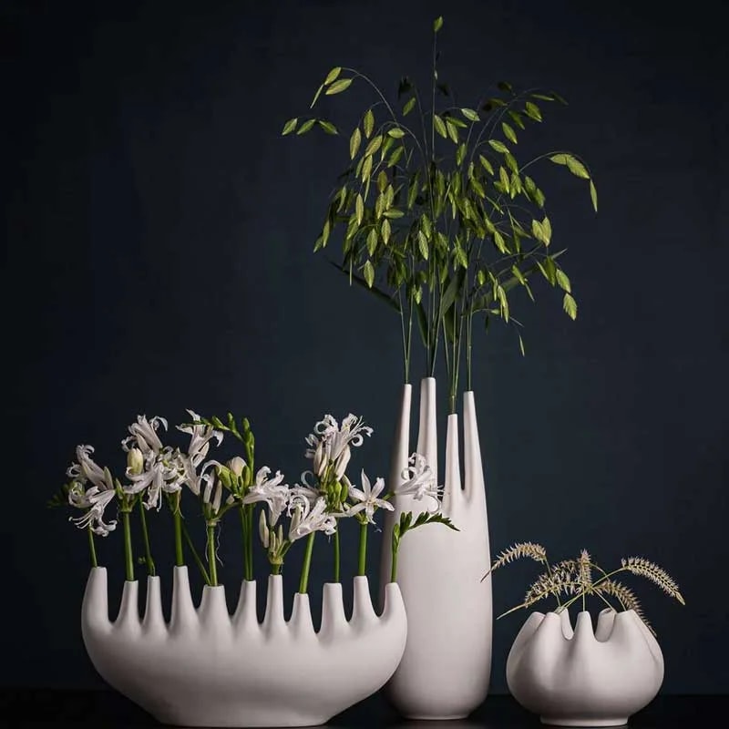 Rhizom 7s piccolo vase shown beside a larger version and a tall tulip vase from the same range