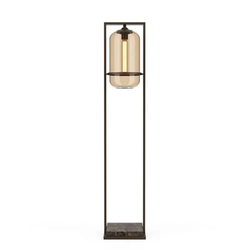 Floor Tube 40 floor lamp with an amber glass tube shade in a bronze frame on a brown marble base