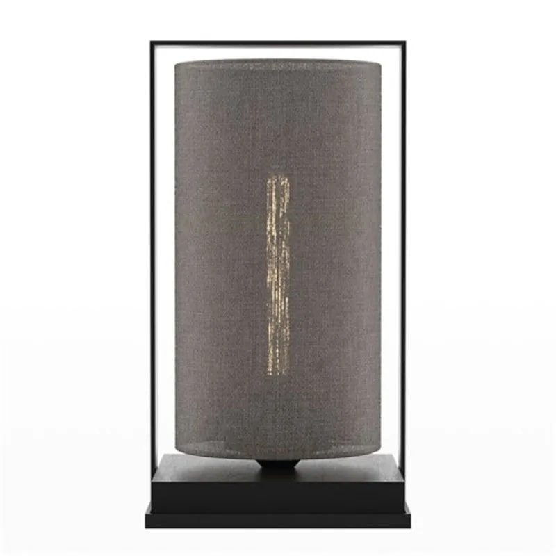 Tube Wood Fabric 40 table lamp with a dark grey fabric cylinder shade in a black frame and wooden base, glowing