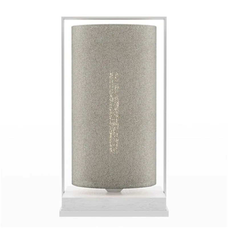 Tube Wood Fabric 40 table lamp with a pale grey-green textured cylinder shade in a white frame, glowing gently