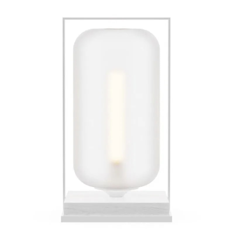 Tube Wood 40 table lamp with a frosted white glass tube shade in a slim white frame on a white base, softly glowing