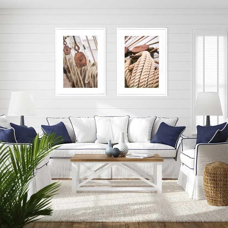 Cordages III pulley print displayed with the rope print on white shiplap in a coastal living room